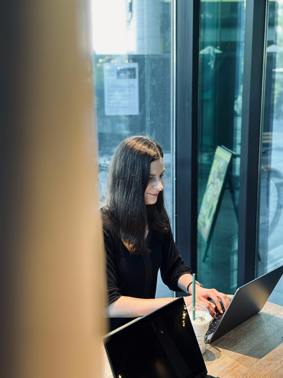 woman coding on laptop at desk