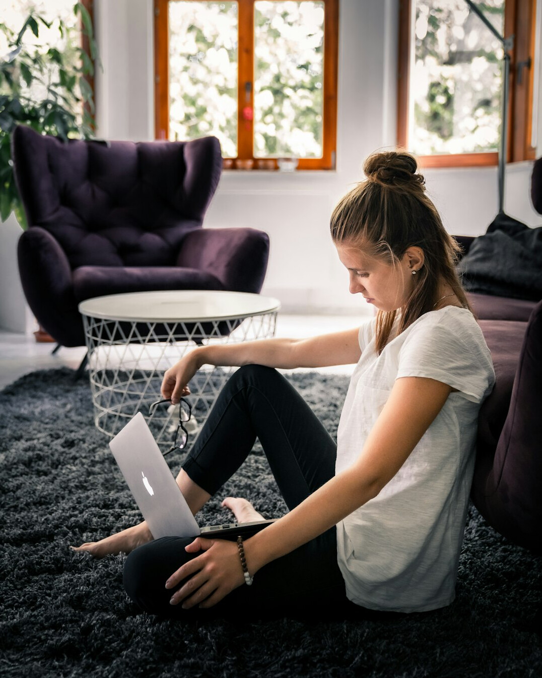 woman coding on laptop at home