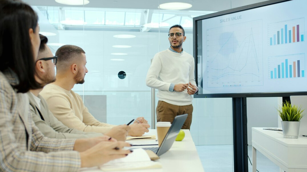 man presenting to group