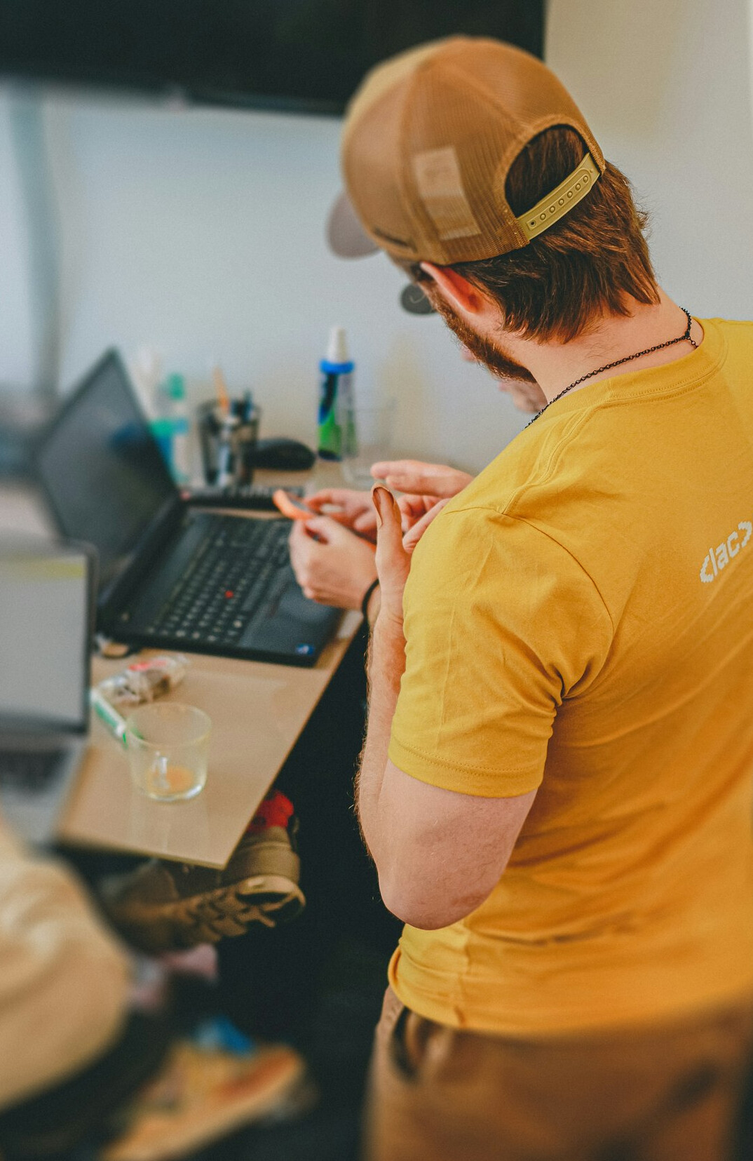 person coding on laptop