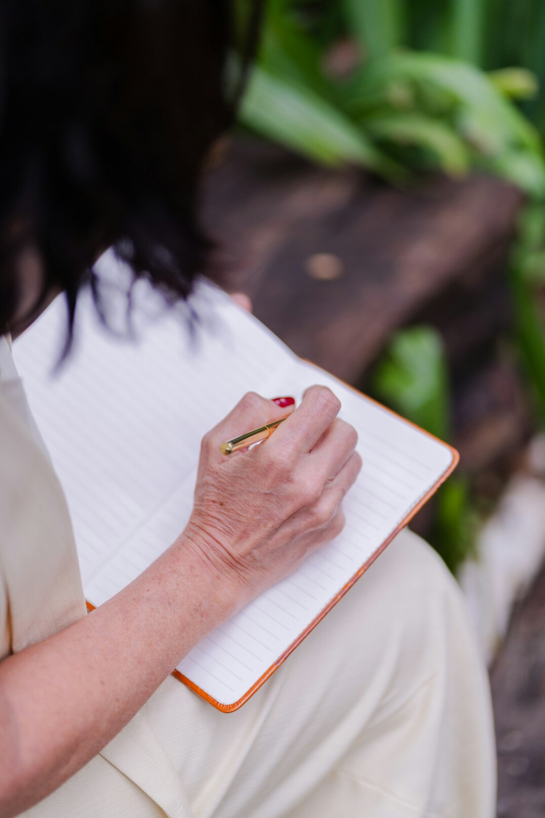 woman writing in notebook